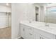 Bright bathroom featuring double vanity, quartz countertops, and a glass-enclosed shower at 564 Red Rock Pl, Brighton, CO 80601