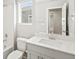 Bathroom featuring a white vanity, sink, mirror, toilet, and shower-tub at 564 Red Rock Pl, Brighton, CO 80601