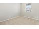 Neutral bedroom with plush carpet, bright natural light, and ample space for personalization at 564 Red Rock Pl, Brighton, CO 80601