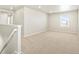 Bright bonus room with neutral carpet, white walls, and ample natural light at 564 Red Rock Pl, Brighton, CO 80601