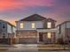 Beautiful two-story home boasting stone accents, a two-car garage, and a well-manicured front lawn at 564 Red Rock Pl, Brighton, CO 80601