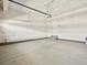 Spacious garage with concrete floor and drywall ready for finishing at 564 Red Rock Pl, Brighton, CO 80601