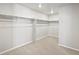 Spacious walk-in closet with shelving and carpeted floor at 564 Red Rock Pl, Brighton, CO 80601