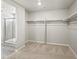 Large walk-in closet with shelving, storage space and tile-look floors at 564 Red Rock Pl, Brighton, CO 80601