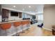 Finished basement is highlighted by a wet bar, large screen TV and comfortable seating at 14049 Detroit Dr, Thornton, CO 80602