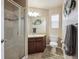 Bathroom features a glass enclosed shower, large vanity, and decorative mirror and lighting at 14049 Detroit Dr, Thornton, CO 80602
