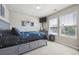 This bedroom offers great natural light, modern colors and ample space for sleeping and relaxing at 14049 Detroit Dr, Thornton, CO 80602
