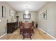 Formal dining room featuring hardwood floors, decorative lighting, and neutral wall color at 14049 Detroit Dr, Thornton, CO 80602