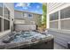 Backyard hot tub situated on a deck with exterior views of the home at 14049 Detroit Dr, Thornton, CO 80602