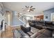 Spacious living room featuring hardwood floors, a fireplace, and an open staircase at 14049 Detroit Dr, Thornton, CO 80602