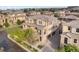 Beautiful multi-story home featuring stone accents, a tile roof, manicured landscaping, and a two-car garage at 3291 Cascina Cir # D, Highlands Ranch, CO 80126