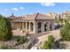 A detailed aerial shot showcasing the stone gazebo and surrounding area featuring mature trees and a landscaped walkway at 3291 Cascina Cir # D, Highlands Ranch, CO 80126