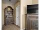 Hallway with a bookshelf and an entertainment center at 3291 Cascina Cir # D, Highlands Ranch, CO 80126