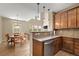 Kitchen next to dining table and featuring stainless steel appliances and tile backsplash at 3291 Cascina Cir # D, Highlands Ranch, CO 80126