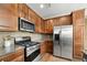 Well-appointed kitchen featuring stainless steel appliances and a large refrigerator at 3291 Cascina Cir # D, Highlands Ranch, CO 80126