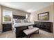 Inviting primary bedroom featuring dark wood furniture set with carpet flooring and plenty of natural light at 3291 Cascina Cir # D, Highlands Ranch, CO 80126