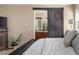 Stylish primary bedroom with a sliding barn door leading to the primary bathroom at 3291 Cascina Cir # D, Highlands Ranch, CO 80126