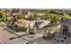 Aerial view of a pool showcasing mature trees and a nice landscape in a well maintained community with a black fence and paved sidewalks at 3291 Cascina Cir # D, Highlands Ranch, CO 80126