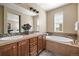 Elegant bathroom with double vanity, soaking tub, and neutral color palette at 3291 Cascina Cir # D, Highlands Ranch, CO 80126