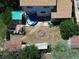 Aerial view showcases the backyard with a pool, fire pit, pergola, and the home's layout at 20391 E 42Nd Ave, Denver, CO 80249