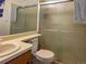 Standard bathroom with a toilet, mirror, sink, and shower with sliding door at 20391 E 42Nd Ave, Denver, CO 80249