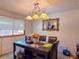 Cozy dining room featuring natural lighting, decorative mirror, and chandelier at 20391 E 42Nd Ave, Denver, CO 80249