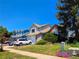 Charming home with well-maintained lawn and mature trees on a sunny day at 20391 E 42Nd Ave, Denver, CO 80249