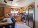 Functional kitchen with stainless steel appliances, wooden cabinets, and natural light at 20391 E 42Nd Ave, Denver, CO 80249