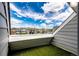 Stylish balcony view highlights a vibrant neighborhood skyline under a bright and clear sky at 17004 E Tennessee Dr # 212, Aurora, CO 80017
