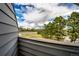 Scenic balcony view showcases lush greenery, with a clear horizon, under a bright, expansive sky at 17004 E Tennessee Dr # 212, Aurora, CO 80017