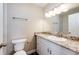Modern bathroom featuring a stylish granite countertop, a vanity, and a mirror with overhead lighting at 17004 E Tennessee Dr # 212, Aurora, CO 80017