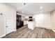 Updated kitchen featuring stainless steel appliances, wood-style floors, and granite countertops at 17004 E Tennessee Dr # 212, Aurora, CO 80017