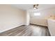 Bright living area with light-colored walls and wood-style floors, plus a ceiling fan and a skylight at 17004 E Tennessee Dr # 212, Aurora, CO 80017
