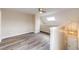 Bright living area with light-colored walls and wood-style floors, plus a ceiling fan and a skylight at 17004 E Tennessee Dr # 212, Aurora, CO 80017