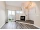 Living room features a fireplace, balcony, and a vaulted ceiling at 17004 E Tennessee Dr # 212, Aurora, CO 80017