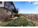 Backyard featuring a patio, hot tub, grass area, and mountain views at 12017 W 54Th Dr, Arvada, CO 80002