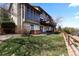Backyard with lush green grass and patio with hot tub at 12017 W 54Th Dr, Arvada, CO 80002