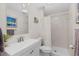 Bathroom features white cabinets, mosaic tile accent, shower and tile flooring at 12017 W 54Th Dr, Arvada, CO 80002