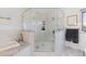 Luxurious bathroom features include a glass enclosed shower and soaking tub at 12017 W 54Th Dr, Arvada, CO 80002