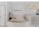 Elegant bathroom featuring a luxurious soaking tub and shower at 12017 W 54Th Dr, Arvada, CO 80002