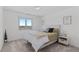 Bright bedroom features a large window and a cozy bed at 12017 W 54Th Dr, Arvada, CO 80002