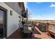 Outdoor deck with patio furniture and a grill, perfect for enjoying the outdoors with views at 12017 W 54Th Dr, Arvada, CO 80002