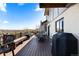 Enjoy outdoor living on this spacious deck with a grill, seating, and scenic neighborhood views at 12017 W 54Th Dr, Arvada, CO 80002