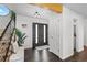 Entryway with hardwood floors, bench seating and front door at 12017 W 54Th Dr, Arvada, CO 80002