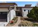 Home exterior showing entryway and three-car garage at 12017 W 54Th Dr, Arvada, CO 80002