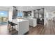 Modern kitchen featuring stainless steel appliances, large island and granite countertops at 12017 W 54Th Dr, Arvada, CO 80002