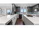 Modern kitchen with sleek cabinetry, a large island, and stainless steel appliances for a seamless cooking experience at 12017 W 54Th Dr, Arvada, CO 80002