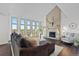 Bright living room with large windows, fireplace, and stylish decor at 12017 W 54Th Dr, Arvada, CO 80002