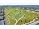 Aerial view showcases a nearby community park with walking trails at 3372 Central Park Blvd, Denver, CO 80238