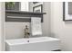 Bright bathroom features modern vanity, decorative mirror, and elegant fixtures at 3372 Central Park Blvd, Denver, CO 80238